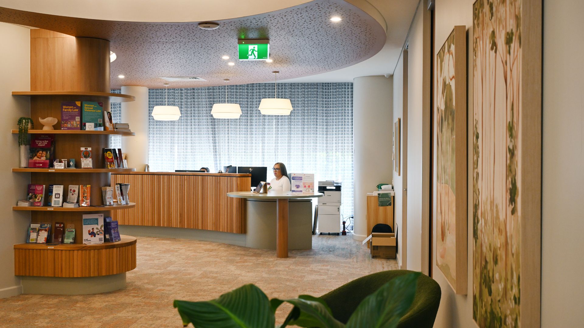 The Women's Trauma Recovery Centre reception. Picture includes the reception desk and book shelf.